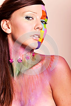 Young brunette woman with colorful makeup