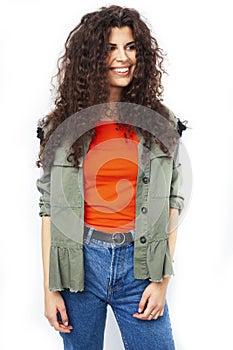 Young brunette woman with curly hairstyle in bright casual clothers isolated on white background gesturing happy smiling