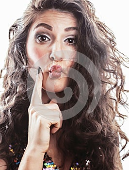 Young brunette woman with curly hairstyle in fancy glamur dress