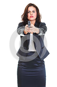 Young brunette woman with gun isolated