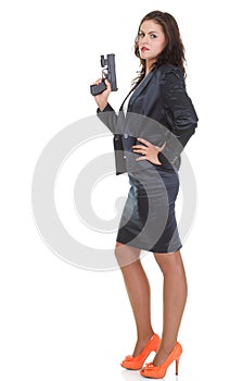 Young brunette woman with gun isolated on white