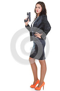 Young brunette woman with gun isolated on white