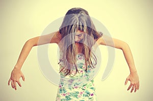 Young brunette woman performing contemporary dance