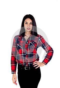 Young brunette woman with plaid shirt and black jeans