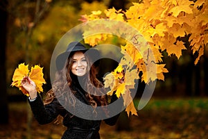 Young brunette woman portrait in autumn color