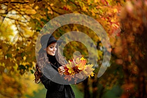 Young brunette woman portrait in autumn color