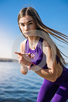 Young brunette woman  practicing yoga early morning before working time.  Concept of wellness and healthy lifestyle