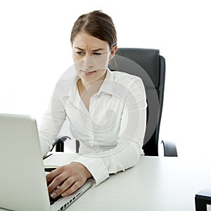 Young brunette woman is uncertain on her desk