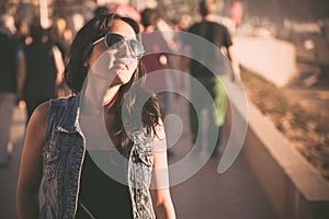 Young brunette woman walking on the street