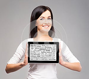 Young bruntte woman holding a tablet