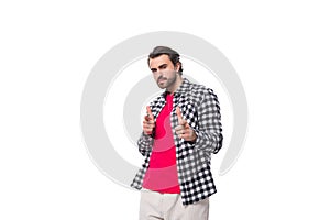 young brutal bearded brunette man in a shirt actively gesticulates on a white background with copy space
