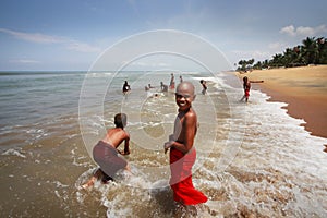 Young Buddhists at ocean