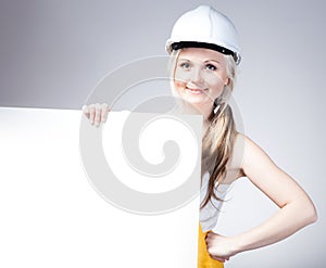 Young builder craftswoman construction worker, empty frame