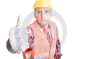 Young builder showing thumbs up