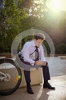 Young buinessman riding to work in the city