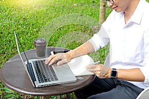 young buseness man work on the table with his laptop