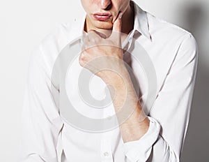 Young businaessman thinking on white background, body part, concept of business people working