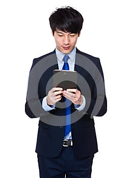 Young business asian man using his tablet