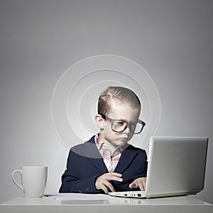 Young business boy with computer