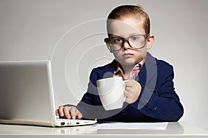 Young business child with computer