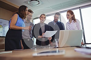 Young business colleagues discussing in metting room