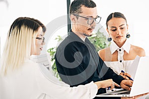 Young business colleagues working together at the office