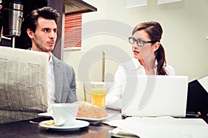 Young Business Couple In A Cafe