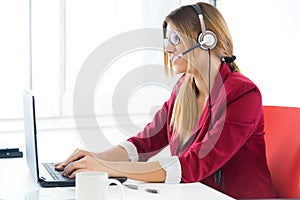 Young business girl using her computer.