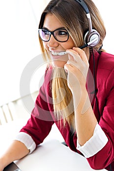 Young business girl using her computer.