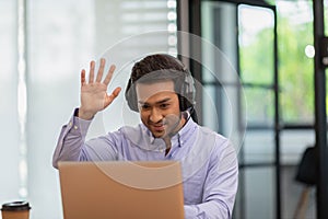 Young business indian man meeting with business team via video conference call at Home