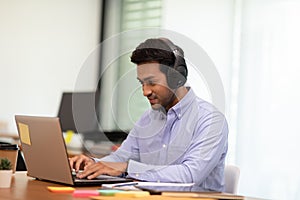 Young business indian man meeting with business team via video conference call at Home