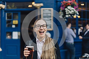 Young business lady with beer.