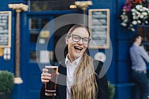 Young business lady with beer.