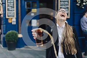 Young business lady with beer.