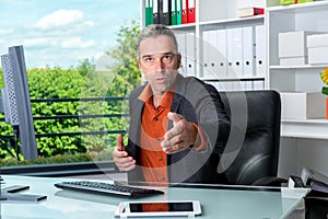 Business man behind his desk greeted a client photo