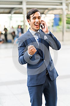 Young business man excite and enjoy of business success on cooperate with partner