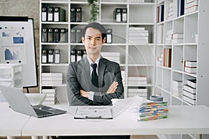 Young business man executive manager looking at laptop watching online webinar training or having virtual meeting video conference