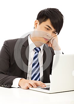 Young business man feel tired or angry with laptop