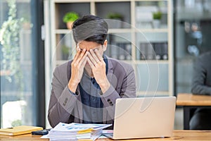 Young business man feeling tired stressed concern upset nervous serius in office, business employee exhausted sad photo