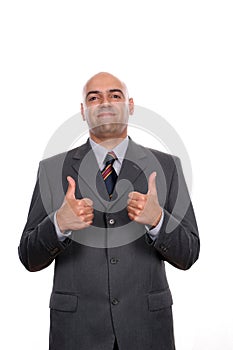 Young business man going thumbs up