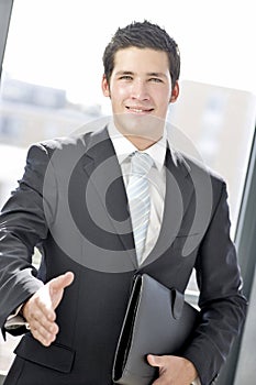 Young business man greeting