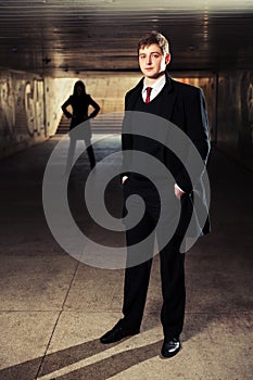 Young fashion business man in underground tunnel