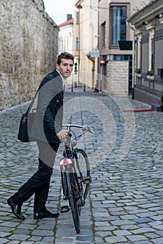 Young business man with his bicycle