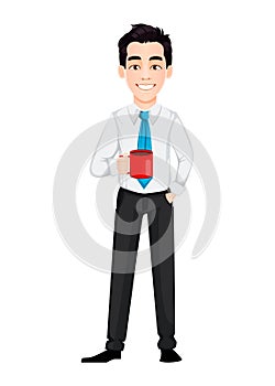 Young business man holding a cup of coffee while coffee break.