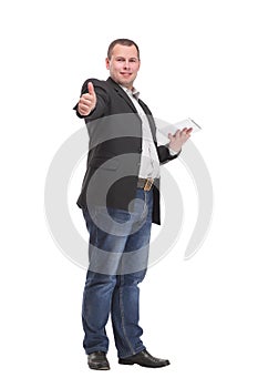 Young business man holding a tablet and showing thumb up while smiling to the camera. on white background