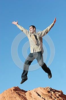 Young business man jumping