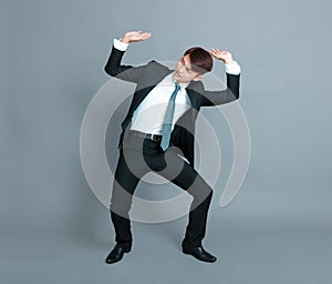 Young business man lifting something