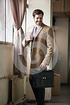 Young business man looking away from the camera.