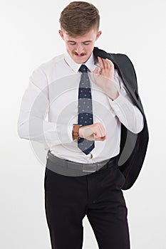 Young business man looking at his watch on white background