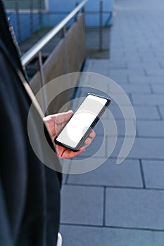 young business man looking phone near to office